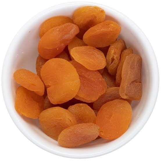 Premium dried apricots in a white bowl